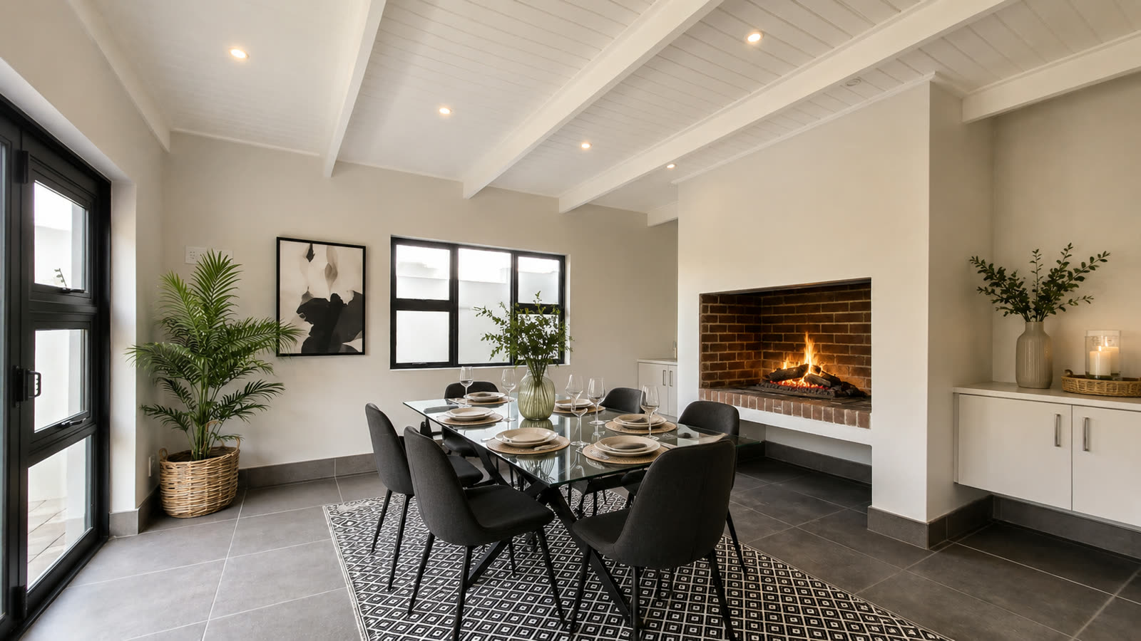 Dining area with built-in fireplace, table set for six