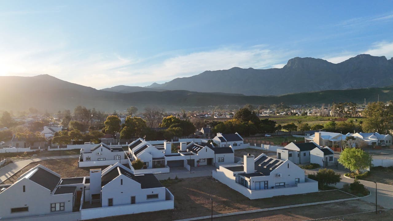 The village at golden hour beneath the Langeberg Mountains